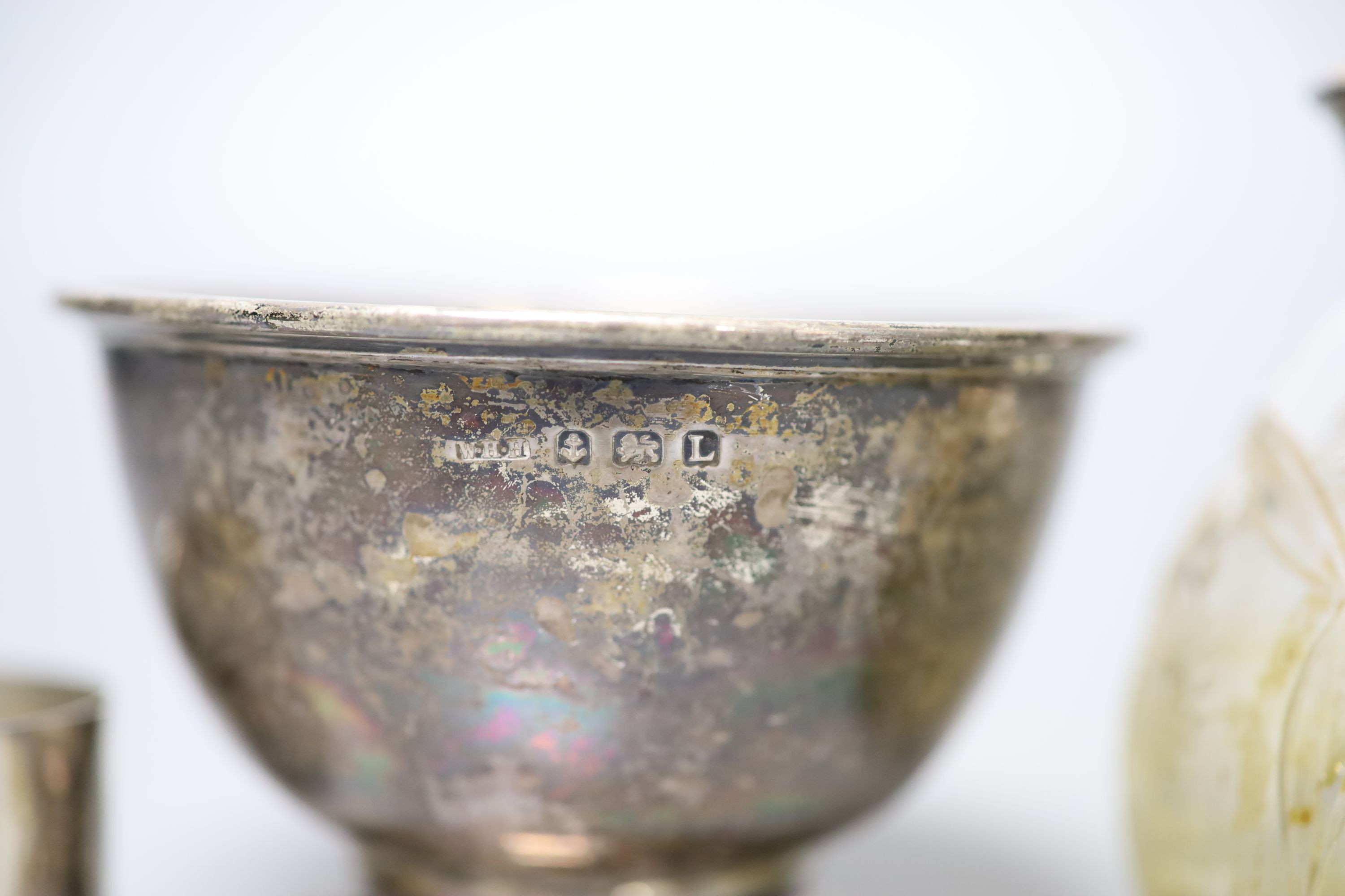 A 1930's silver sugar bowl, two silver napkin rings and a sterling and enamel mounted glass atomiser.